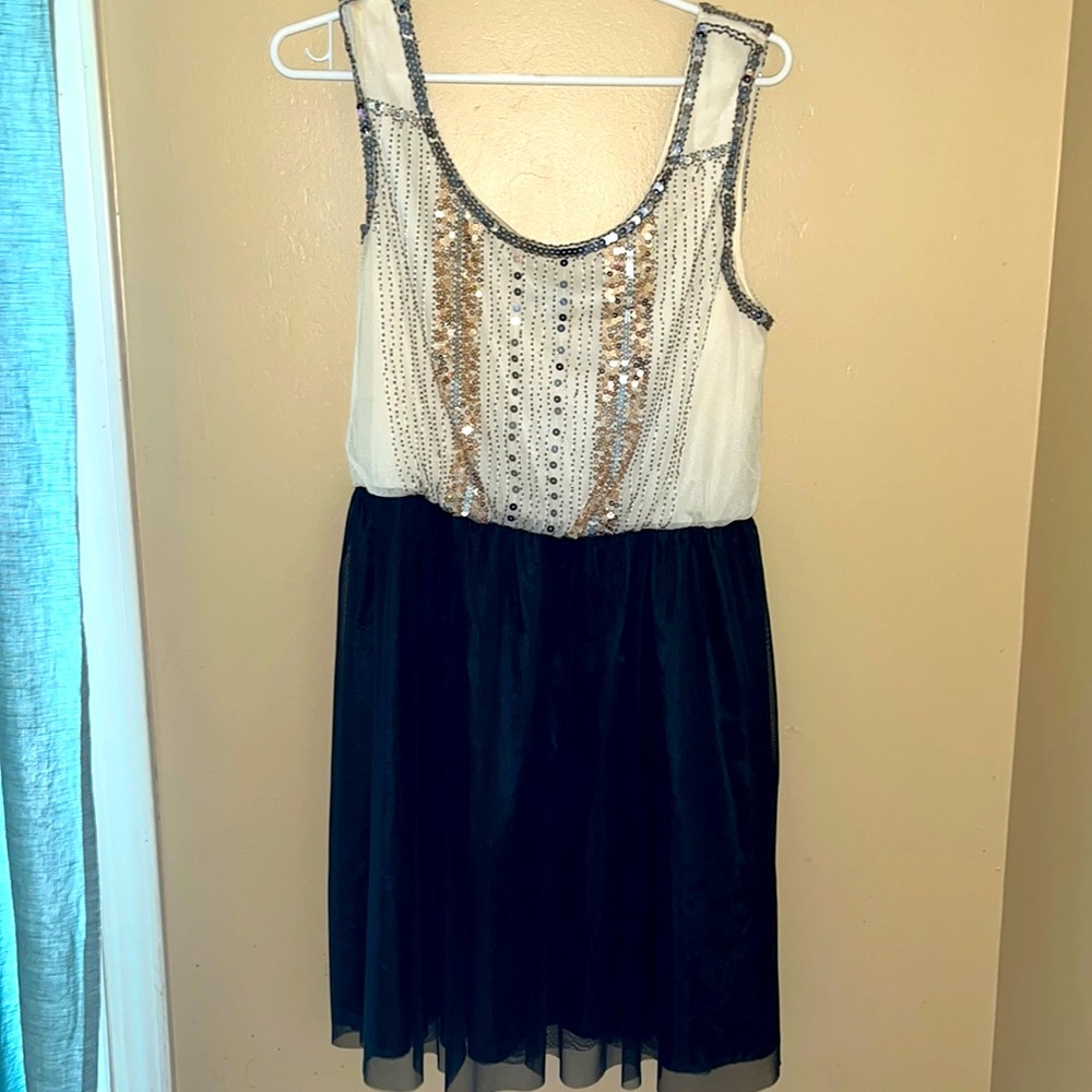 Mid thigh dress with embroidered sequence detail on front & back w/tulle skirt.